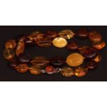 Modern large Baltic amber bead specimen necklace, the oval beads of mixed colours to a white metal