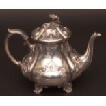 Victorian teapot of lobed baluster form with hinged and domed cover with cast and applied floral