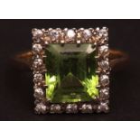 Early 20th century diamond and peridot ring, the square cut peridot (5mm) surrounded by 18 single