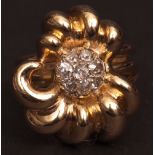 Mid-20th century 18ct gold and diamond cluster ring, a stylised flower head design with a central