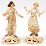 Pair of Derby figures of a dandy with a whip and his female companion, each with red printed and