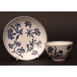 A Lowestoft tea bowl & saucer c1780 transfer printed with floral sprays within a double blue line