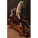 Good quality mid-20th century rocking horse, dapple grey horse with a leather saddle on a pine