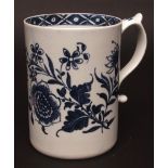 An impressive Lowestoft tankard c1768 painted in dark blue with two large floral sprays with flowers