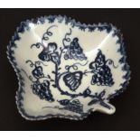 A Lowestoft pickle dish c1768 of trefoil shape with stalk handle decorated with fruiting vine within