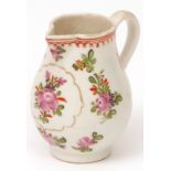 A Lowestoft cream jug c.1780, the pear shaped body decorated in Curtis style with trailing