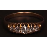 Early 20th century mid-grade yellow metal and five-stone diamond ring, boat shaped and set with five