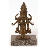 Well cast and modelled brass multi-armed and multi-faced deity, possibly Indian or Tibetan,