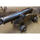Vintage brass short barrelled cannon on a hardwood four-wheeled carriage, 39" long overall