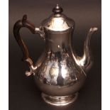 Victorian coffee pot of plain polished baluster form with hinged and domed cover and bearing