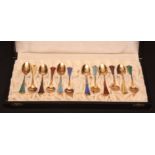 Cased set of 12 Norwegian silver gilt and enamelled coffee spoons, each with various pastel