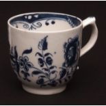 A Lowestoft coffee cup c1768 decorated with a central flowerhead and meandering flowers within a