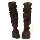 Pair of ornate carved ebony or hardwood African fertility masks formed as the heads of a tribal male