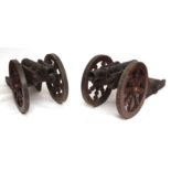 Pair of 19th century painted cast metal cannons, bearing the Hapsburg crest, with hardwood metal