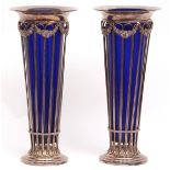 Pair of unusual silver plated large spill vases of trumpet form with flared circular necks, hung