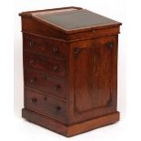 Victorian rosewood davenport, plain top with fall front and gilt tooled green leather inset,