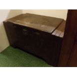 20th century camphor wood storage trunk with decorative carved Oriental scenes to front and top