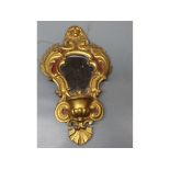 19th century giltwood small water font mirror with gilded rococo style design with figurehead top