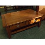 Stained pine framed rectangular plank top coffee table with two drawers, brass scalloped handles,