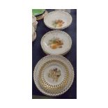 Group of eleven continental ribbon edged plates, with pear printed decorated centres