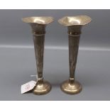 Pair of Birmingham silver spill vases with flared tops and loaded bases, 8 ins tall