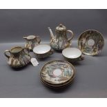 Satsuma decorated part tea set with figural decoration and with gilded design, comprising bulbous