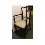 Edwardian mahogany framed armchair with pierced back and shaped arms, tapering legs, on pad feet,