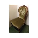 Victorian mahogany balloon back nursing chair with carved foliage back rail, green Dralon