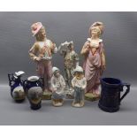 Pair of continental classical figures, modelled as lady and gent, together with two children,