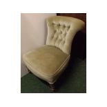 Small Victorian framed green Dralon upholstered nursing chair with turned front legs, raised on