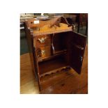 Late Victorian oak smokers cabinet, two carved doors with fitted interior, 12 1/2 ins x 7 ins x 18