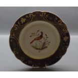 19th century Bloor Derby plate, centrally decorated with exotic bird with green and gilded rim, 9