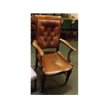 20th century mahogany framed office armchair with carved out seat and shaped arms, red leather