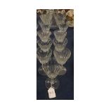 Part set of eighteen pieces of fluted Baccarat glass wares, comprising five champagne glasses,