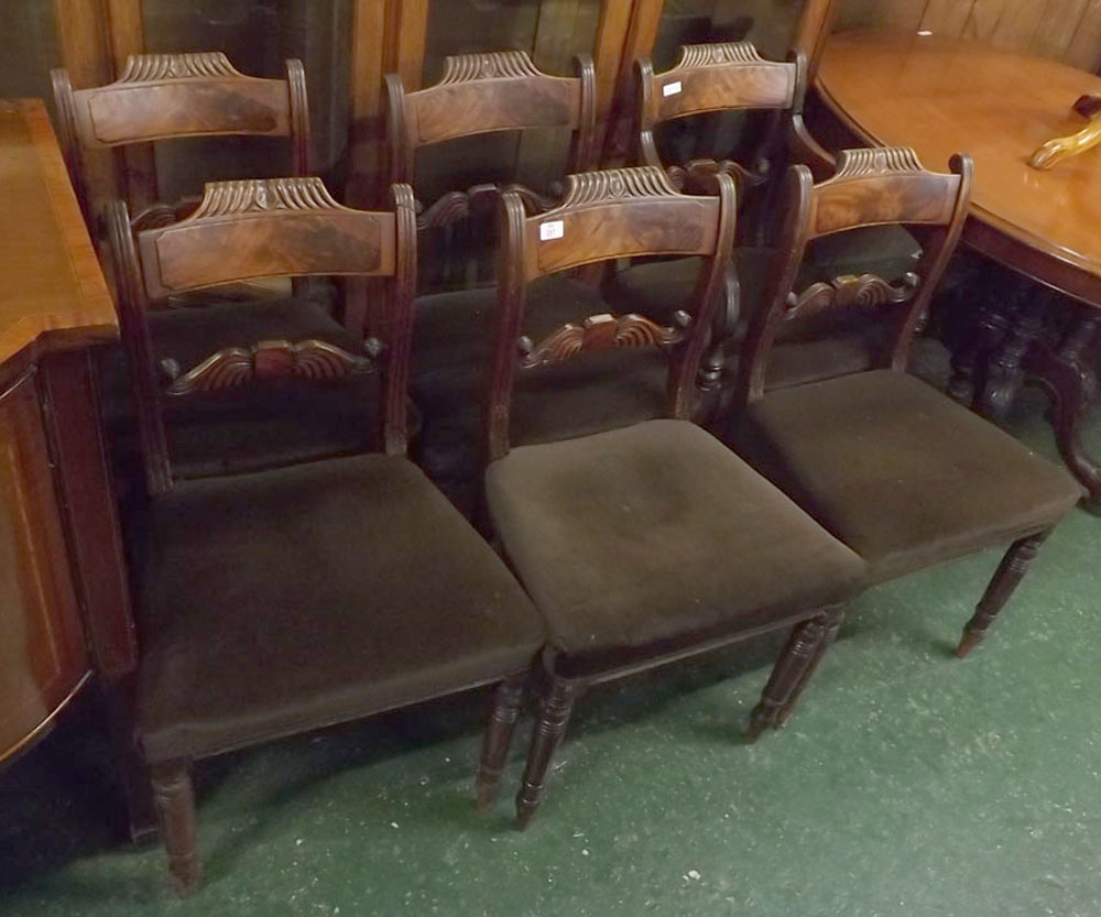 Set of six William IV mahogany dining chairs with shaped and carved bar back on tapering cylindrical