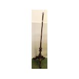 19th century mahogany pole screen converted to a standard lamp on a carved tripod base with