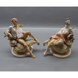 Pair of Capodimonte recumbent figures of lady and gent, raised on a circular gilded pedestal (A/