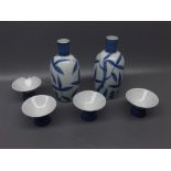 20th century Japanese porcelain sake set, comprising two bottles and four tasters, decorated with