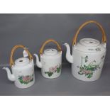 Graduated set of three modern Oriental teapots, largest 10"