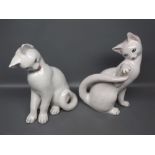 Pair of mid-20th century Italian white glazed cat ornaments, each in naturalistic pose, 10 ins
