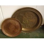 Middle Eastern circular copper tray with engraved detail, 12ins diameter, together with a 20th