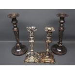 Pair of Victorian Sheffield plated candlesticks, with shaped square bases and knopped stems, 9 ins