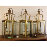 Set of three 20th century brass and glass panelled hall lanterns, each of hexagonal shape and with
