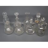 Group of eight assorted 19th/20th century cut glass decanters of various designs, the tallest 10 ins