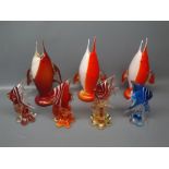 Group of six 20th century Murano glass fish ornaments, one blue and white and the remainder red