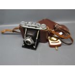 Leather cased Agfa Isolette compact German camera, together with a further Zeiss Akon light meter