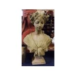 Composition bust of a young lady with flowers in her hair, raised on a square plinth, 19ins tall