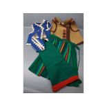 Small group of Hungarian, Romanian and Yugoslavian clothing, including trousers, two aprons and