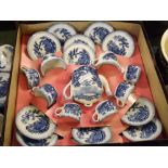 Boxed Ridgways blue and white printed child's tea/dinner service comprising a small teapot, sugar