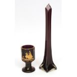 Bohemian heavy amethyst glass goblet with circular base and multi-faceted top, gilded with details